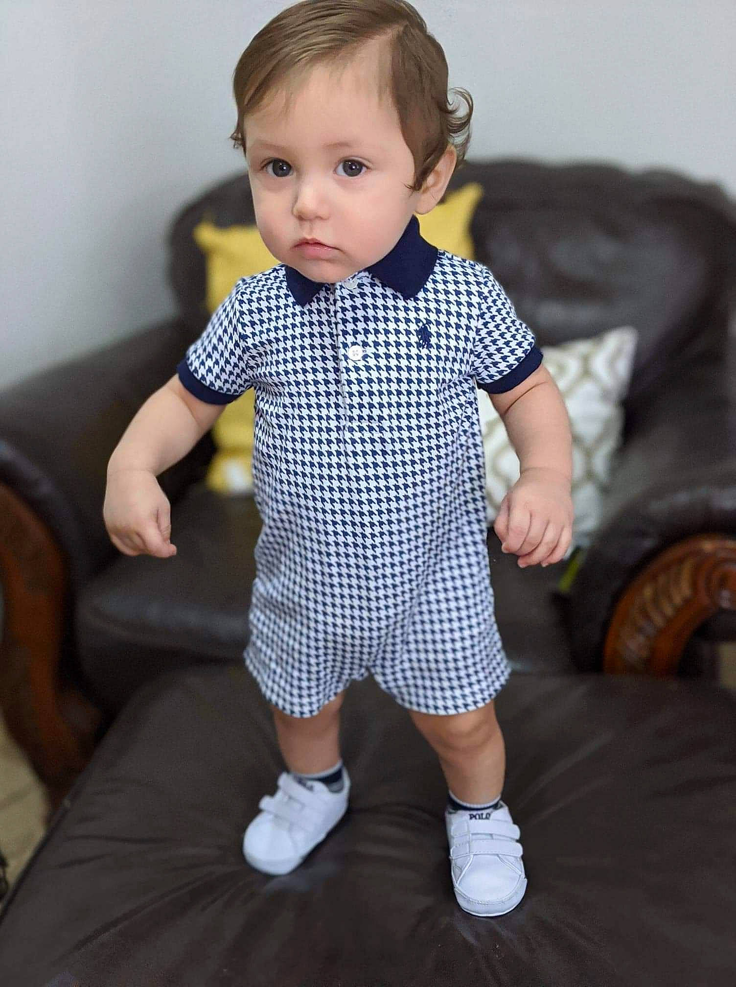 Denzel joined the competition — help win amazing prizes! baby, baby_toddler_clothing, cheek, child, child_model, design, footwear, pattern, person, plaid, product, shoe, sitting, skin, sleeve, standing, t_shirt, toddler