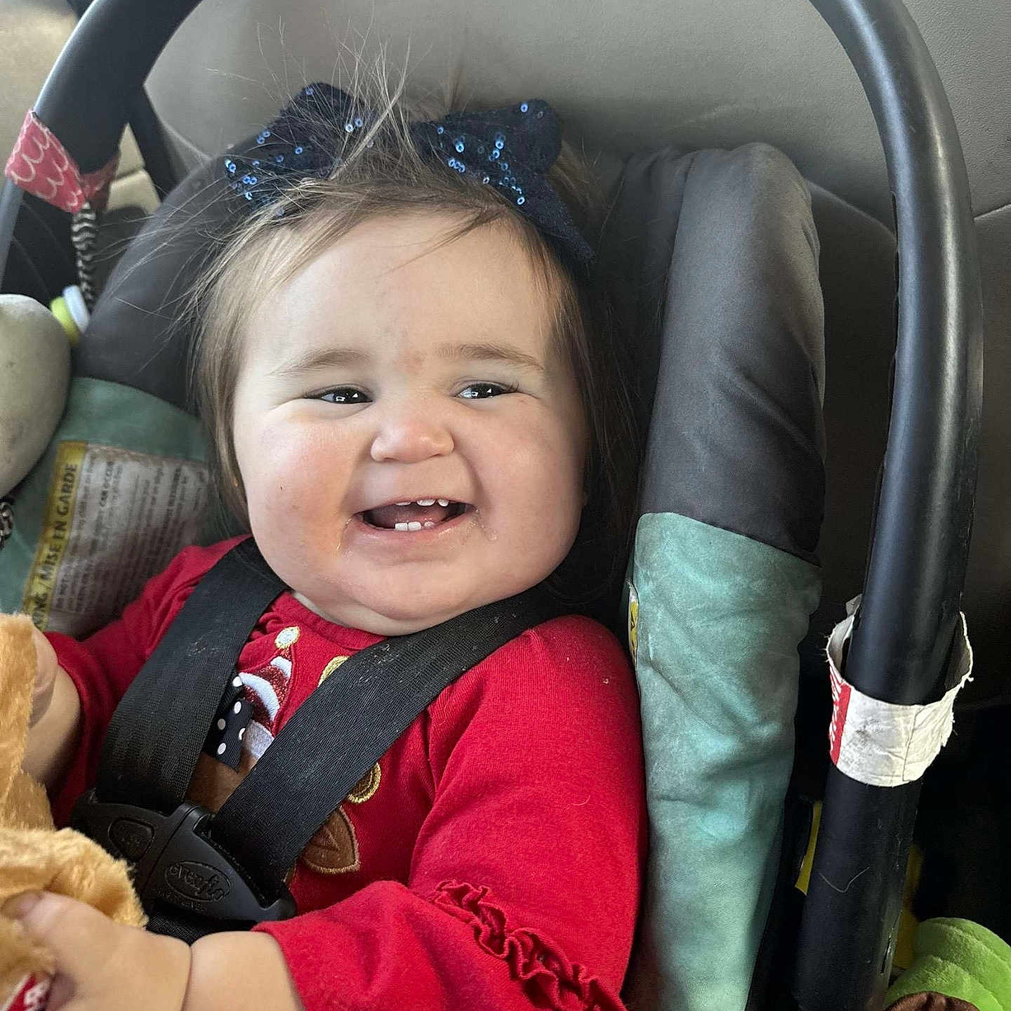 Brynleigh is registered to the contest to win money with this photo: accessories, baby, babylaughing, bodypart, clothing, coat, cushion, face, happy, head, homedecor, jacket, mouth, person, photography, portrait, smile, teeth, transportation, vehicle