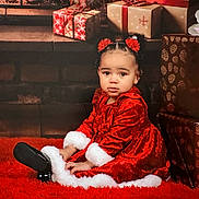 Amina joined the competition — help win amazing prizes! carpet, celebration, child, christmas_presents, curly_hair, cute, decor, festive, fur_trim, gift_wrap, hair_accessories, holiday, holiday_theme, indoor, portrait, red_dress, seasonal, sitting, toddler, young_child
