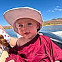baby, child, hat, smile, outdoor, water, sky, sunny, clothing, person, face, happy, nature, summer, portrait, boat, landscape, headwear, daylight, blue_sky