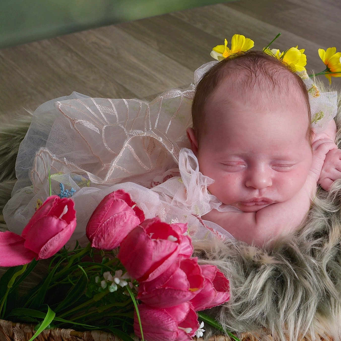 Faye joined the competition — help win amazing prizes! baby, newborn, sleeping, flower_crown, pink_tulips, basket, fur, soft, cozy, portrait, infant, cute, peaceful, resting, delicate, flowers, nature, indoor, closeup, adorable