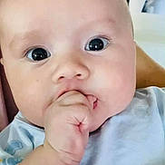 Ethan joined the competition — help win amazing prizes! baby, infant, close_up, hand, fingers, face, eyes, blue_clothing, cute, child, skin, person, indoors, soft_light, portrait, young, newborn, expression, baby_garment, sucking_fingers