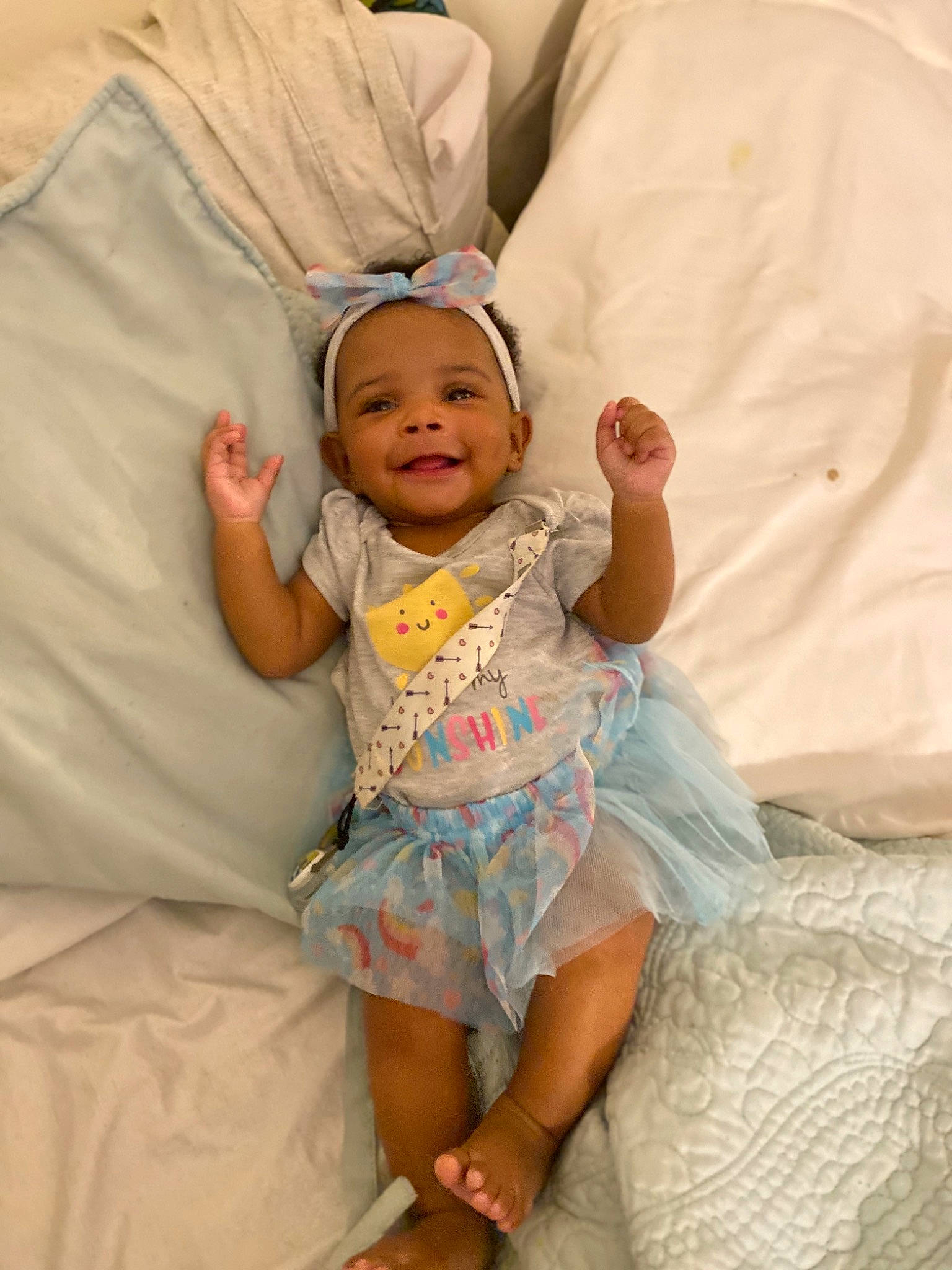 Brea is registered to the contest to win money with this photo: baby, child, comfort, joy, linens, person, product, skin, smile, toddler