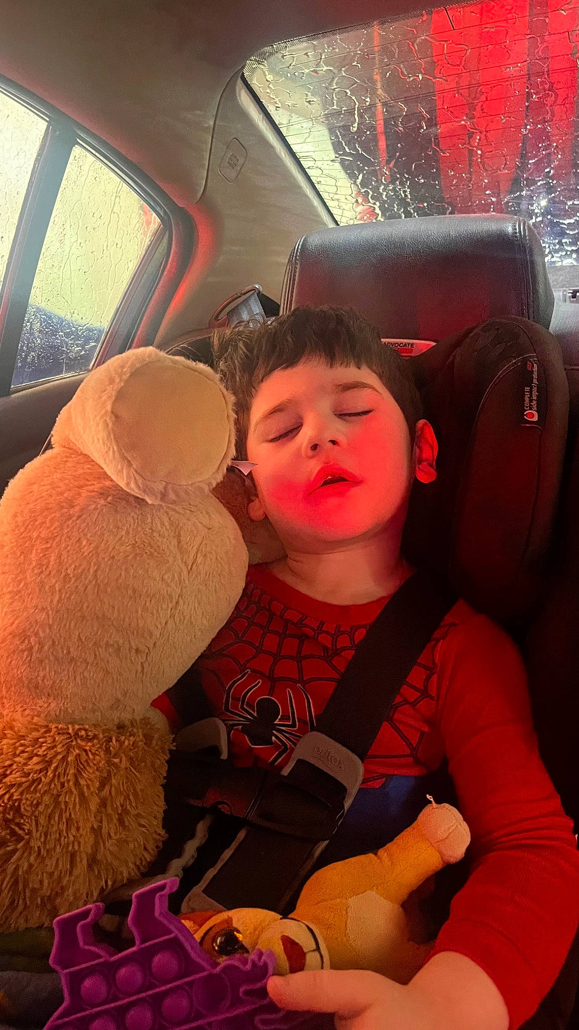 Edwin Jr is registered to the contest to win money with this photo: auto_part, automotive_design, automotive_exterior, automotive_lighting, car_seat, car_seat_cover, child, event, eyewear, family_car, fun, hat, luxury_vehicle, motor_vehicle, person, personal_protective_equipment, red, steering_wheel, toddler, vacation