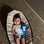 Emmily is registered to the contest to win money with this photo: baby, infant, plush_toy, blue, stitch, carpet, baby_seat, indoor, toy, child, person, cute, clothing, sleeveless, relaxing, expression, hair, foot, hand, background