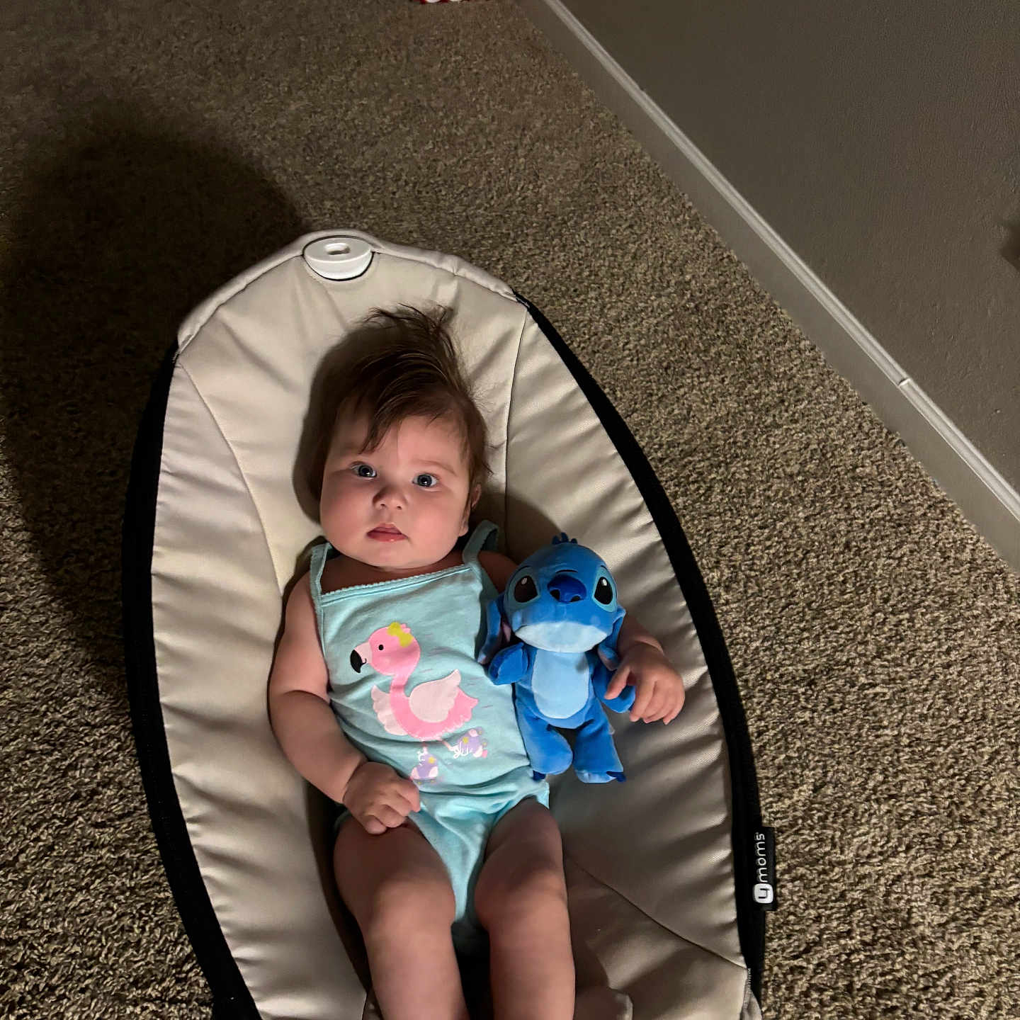 Emmily is registered to the contest to win money with this photo: baby, baby_seat, background, blue, carpet, child, clothing, cute, expression, foot, hair, hand, indoor, infant, person, plush_toy, relaxing, sleeveless, stitch, toy