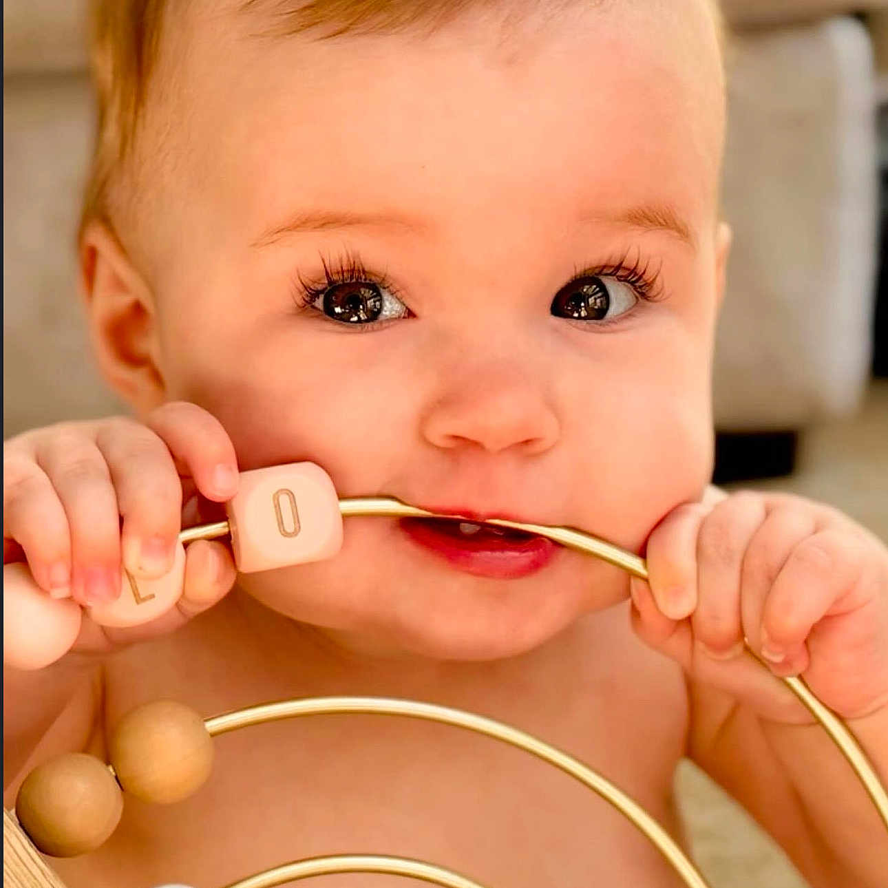 Corah is registered to the contest to win money with this photo: baby, biting, blonde, bodypart, eating, face, food, hair, happy, head, jaw, person, smile