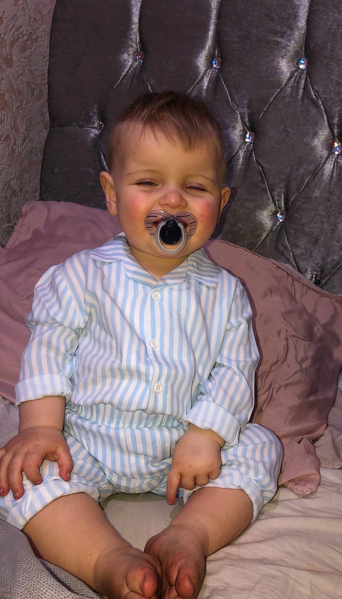 Arlo is registered to the contest to win money with this photo: arm, baby_toddler_clothing, cheek, chin, comfort, eye, facial_expression, finger, hairstyle, head, iris, mouth, nose, organ, person, photograph, product, skin, sleeve, textile