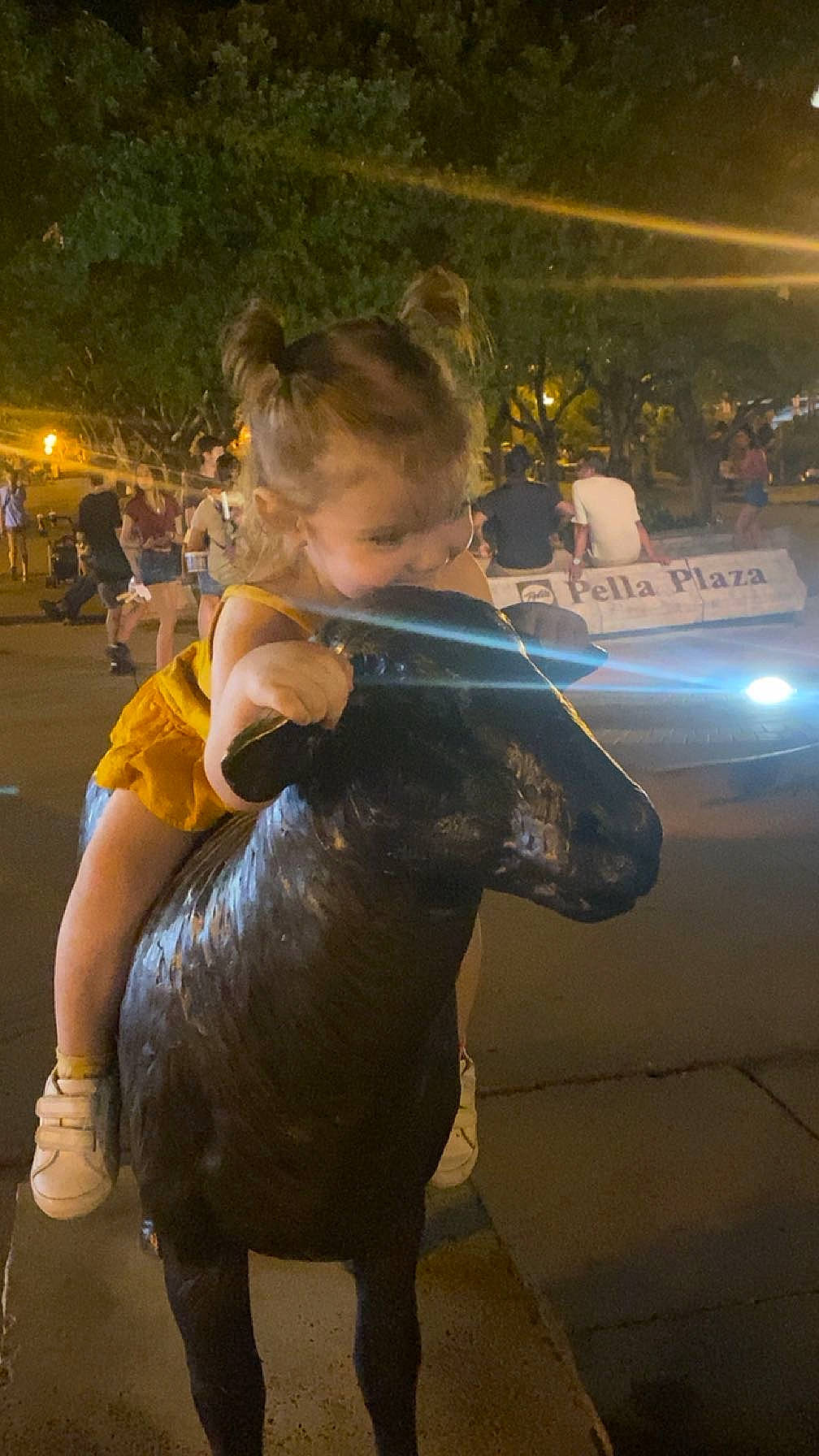 Rosalynn joined the competition — help win amazing prizes! bronze_sculpture, child, city, entertainment, event, flooring, fun, fur, happy, human_leg, leisure, metal, night, pedestrian, person, public_event, recreation, toddler, working_animal