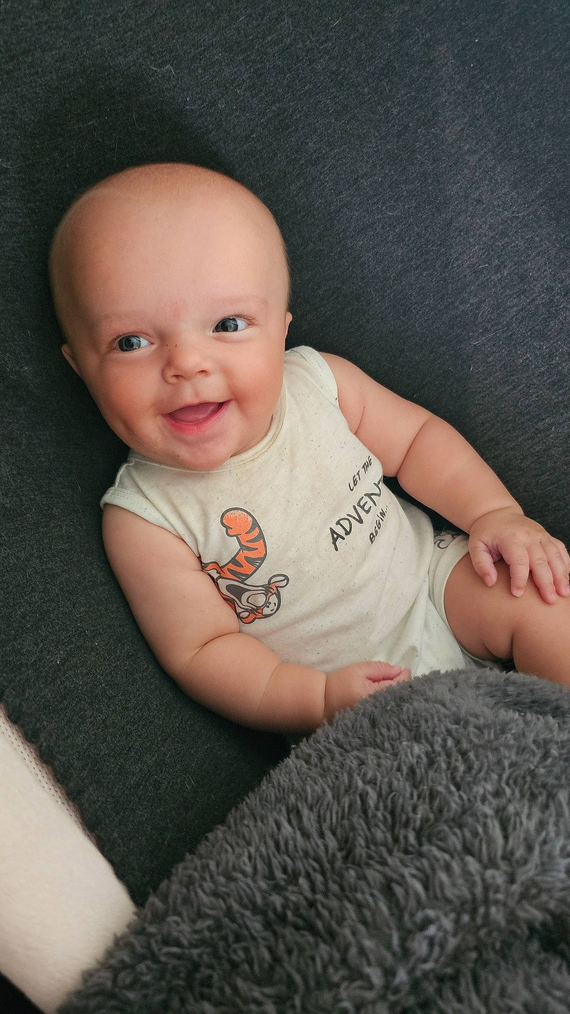 Lochlan joined the competition — help win amazing prizes! baby, baby_toddler_clothing, cheek, chin, comfort, eye, finger, flash_photography, flooring, gesture, grey, iris, joy, lip, mammal, nose, person, skin, sleeve, smile