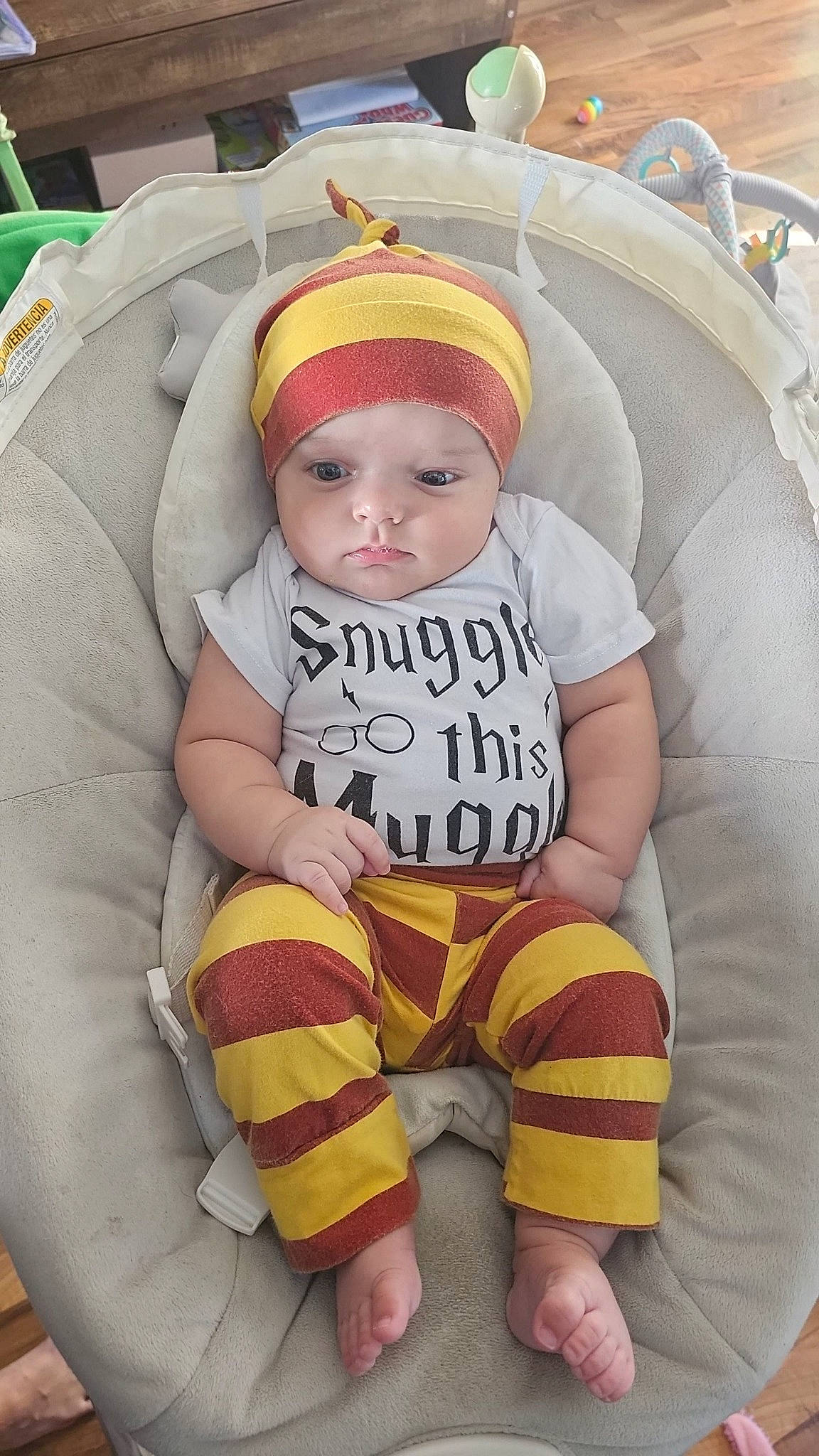 Lochlan joined the competition — help win amazing prizes! baby, baby_carriage, baby_sleeping, baby_toddler_clothing, cap, chair, cheek, child, comfort, headwear, leg, mammal, orange, person, product, skin, sleeve, sock, textile, thigh