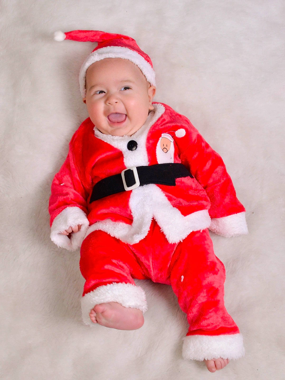 Dante is registered to the contest to win money with this photo: baby, baby_toddler_clothing, cap, carmine, child, christmas, clothing, collar, comfort, costume, face, fictional_character, happy, hat, headwear, outerwear, pattern, person, sleeve, smile