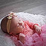 baby, sleeping, infant, pink_dress, headband, flower, lace, tulle, blanket, soft_texture, peaceful, newborn, portrait, cute, child, indoor, closeup, adorable, resting, young