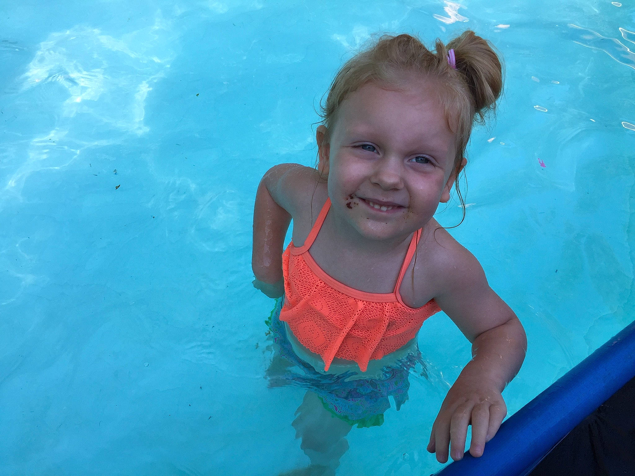 Amberlynn is registered to the contest to win money with this photo: azure, child, face, facial_expression, fun, happy, joy, leisure, person, play, product, recreation, skin, smile, summer, swimmer, swimming, swimming_pool, toddler, vacation