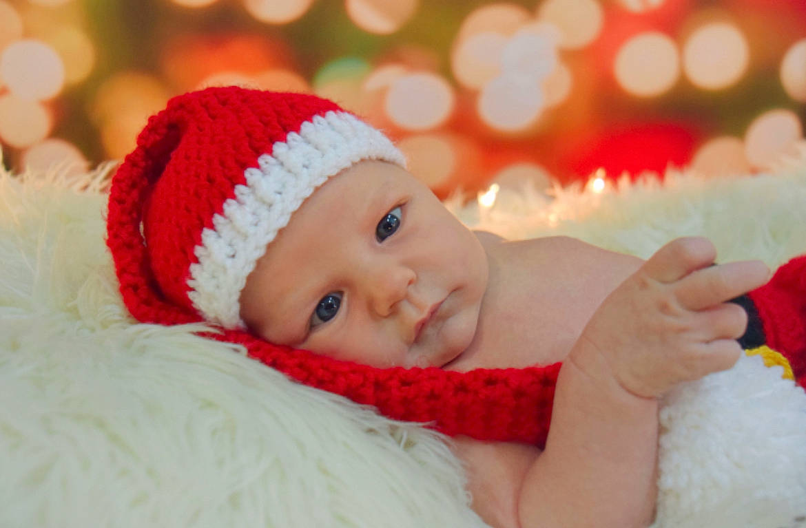 Addi is registered to the contest to win money with this photo: baby, baby_sleeping, baby_toddler_clothing, cap, child, close_up, comfort, event, facial_expression, fashion_accessory, fur, happy, hat, headgear, headwear, holiday, lip, person, skin, textile