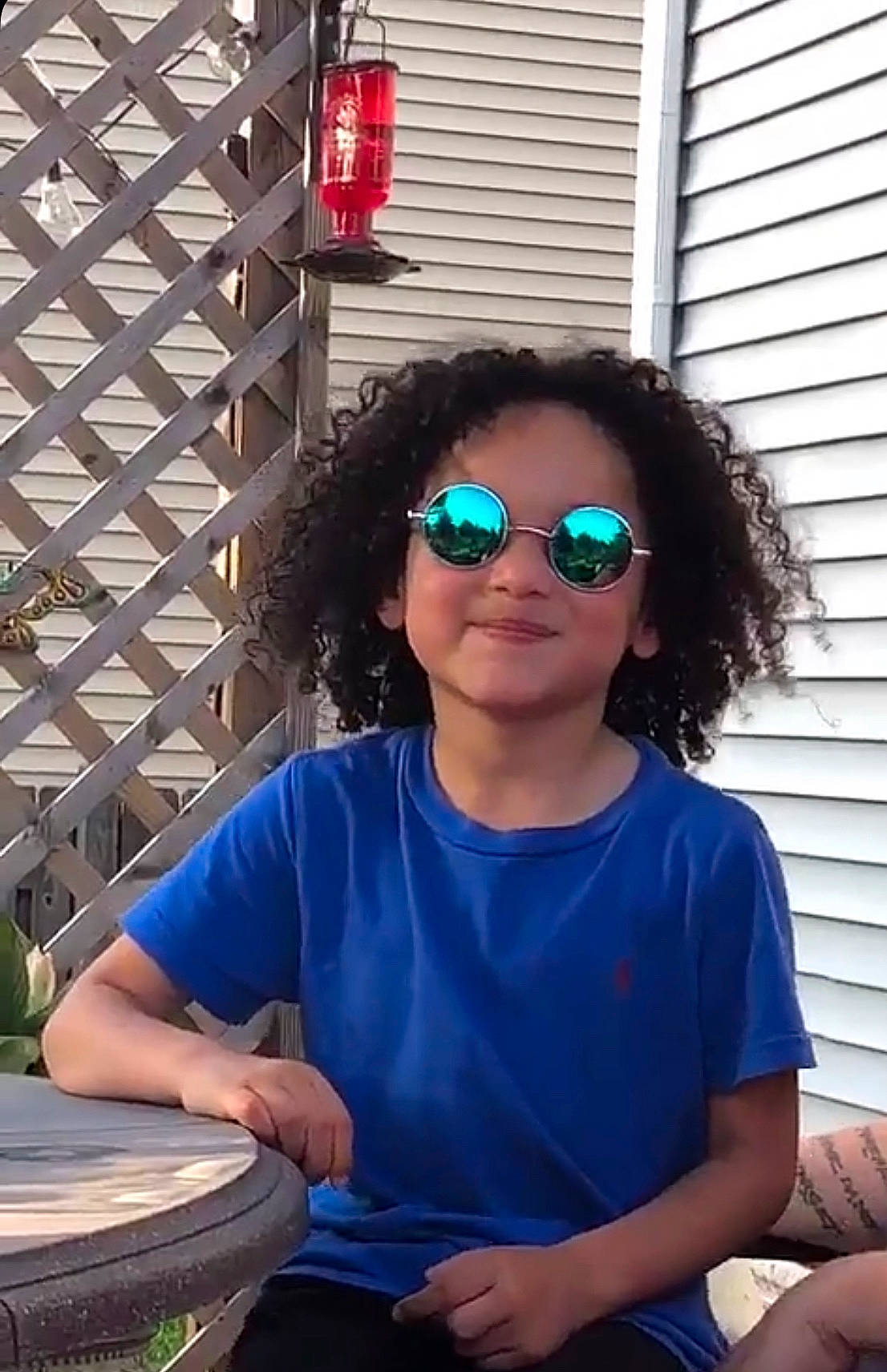 Jayden is registered to the contest to win money with this photo: blue, cool, eyewear, fun, glasses, joy, leisure, person, sitting, sunglasses, vacation, vision_care