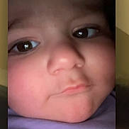 June is registered to the contest to win money with this photo: child, toddler, face, selfie, close_up, portrait, expression, curious, pouty, skin, eyes, nose, mouth, phone_screen, technology, indoors, purple_clothing, baby, person, photography