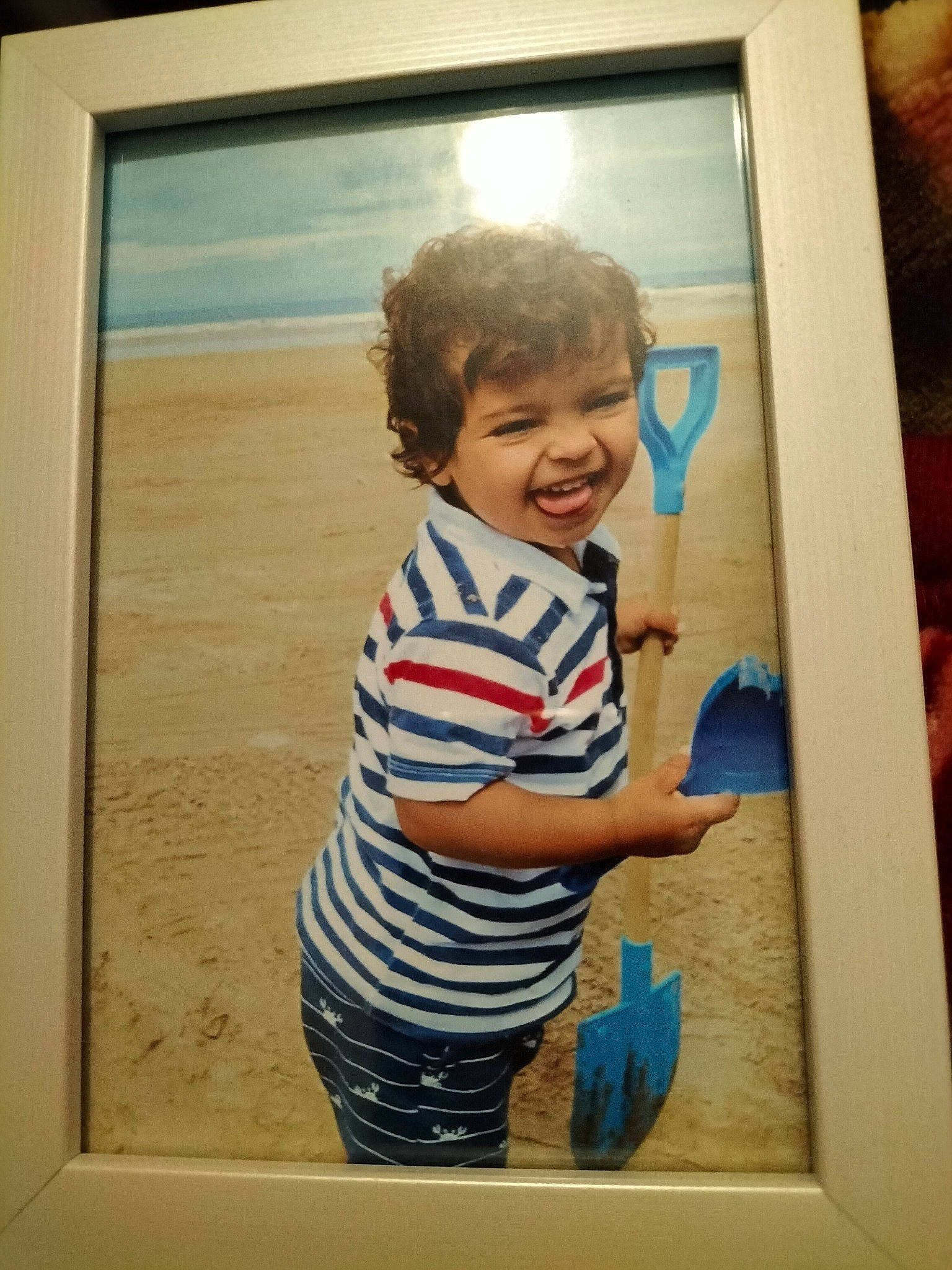 Dawood joined the competition — help win amazing prizes! art, child, electric_blue, electronic_device, happy, human_body, paint, painting, person, picture_frame, rectangle, room, sleeve, smile, standing, t_shirt, technology, toddler, visual_arts, window