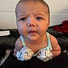 Annalee is registered to the contest to win money with this photo: baby, infant, face, eyes, curious, mittens, clothing, skin, expression, indoors, portrait, child, young, person, head, closeup, sleeveless, background, soft, resting