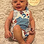 Grayson is registered to the contest to win money with this photo: baby, infant, smiling, romper, blue, white, stars, popsicle, wooden_sign, two_months, fluffy_rug, skin, face, hands, feet, cute, happy, lying_down, clothing, portrait