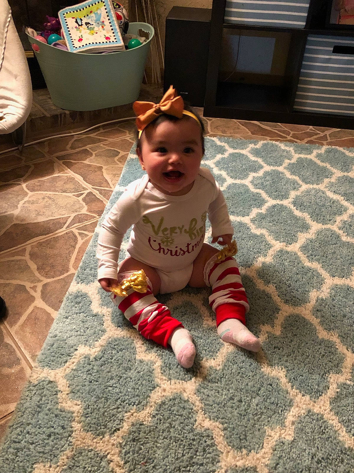 Brinlee is registered to the contest to win money with this photo: child, day, floor, flooring, fun, girl, infant, person, play, product, sitting, skin, textile, toddler, vacation