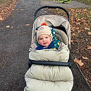 Sacha participe au concours pour gagner de l'argent avec cette photo : baby, bench, cap, car, clothing, face, furniture, grass, hat, head, nature, outdoors, park, person, photography, plant, portrait, transportation, tree, vehicle