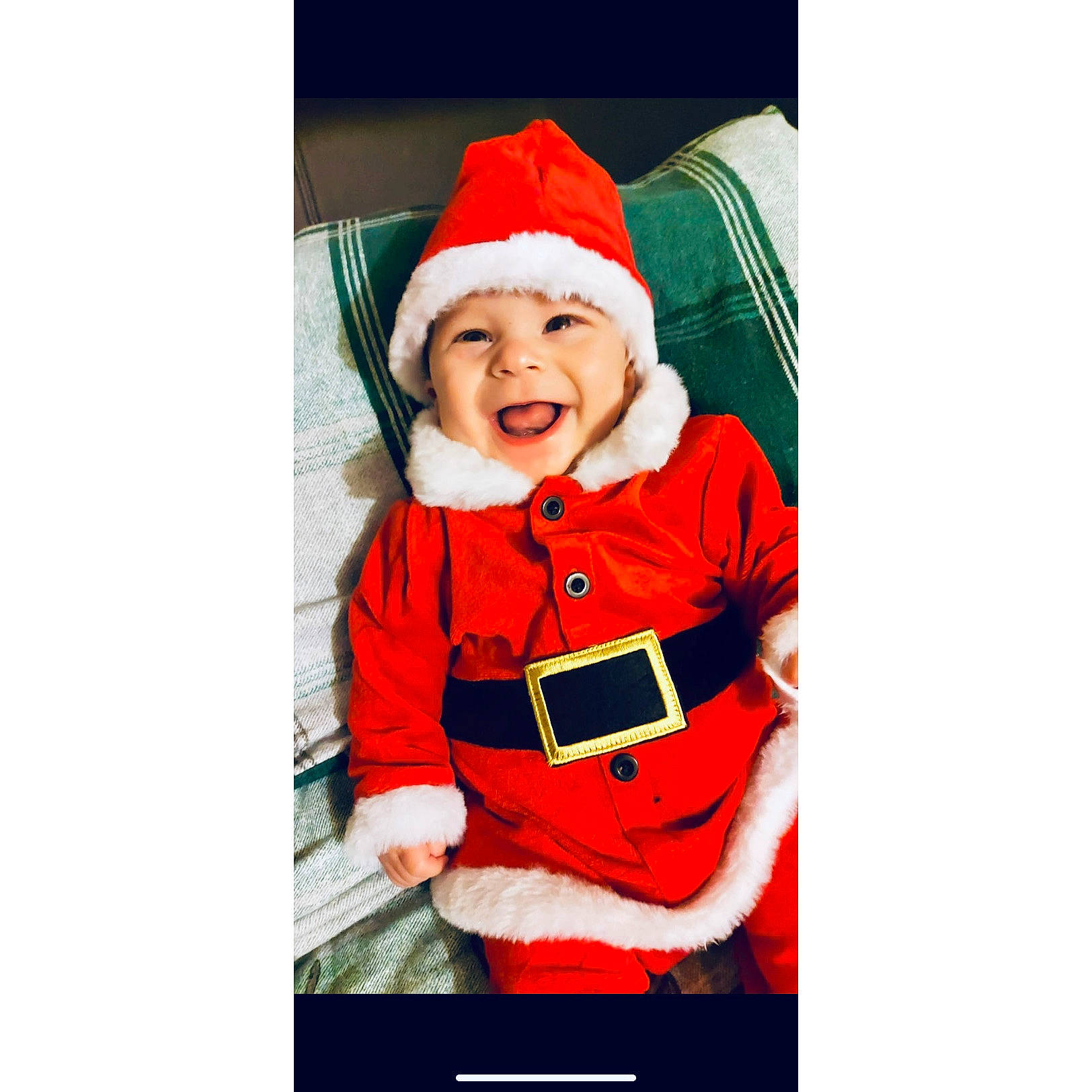 Archer is registered to the contest to win money with this photo: baby, baby_toddler_clothing, cap, christmas, christmas_eve, costume_hat, event, fictional_character, font, happy, hat, headwear, holiday, hood, jacket, person, santa_claus, sitting, sleeve, smile