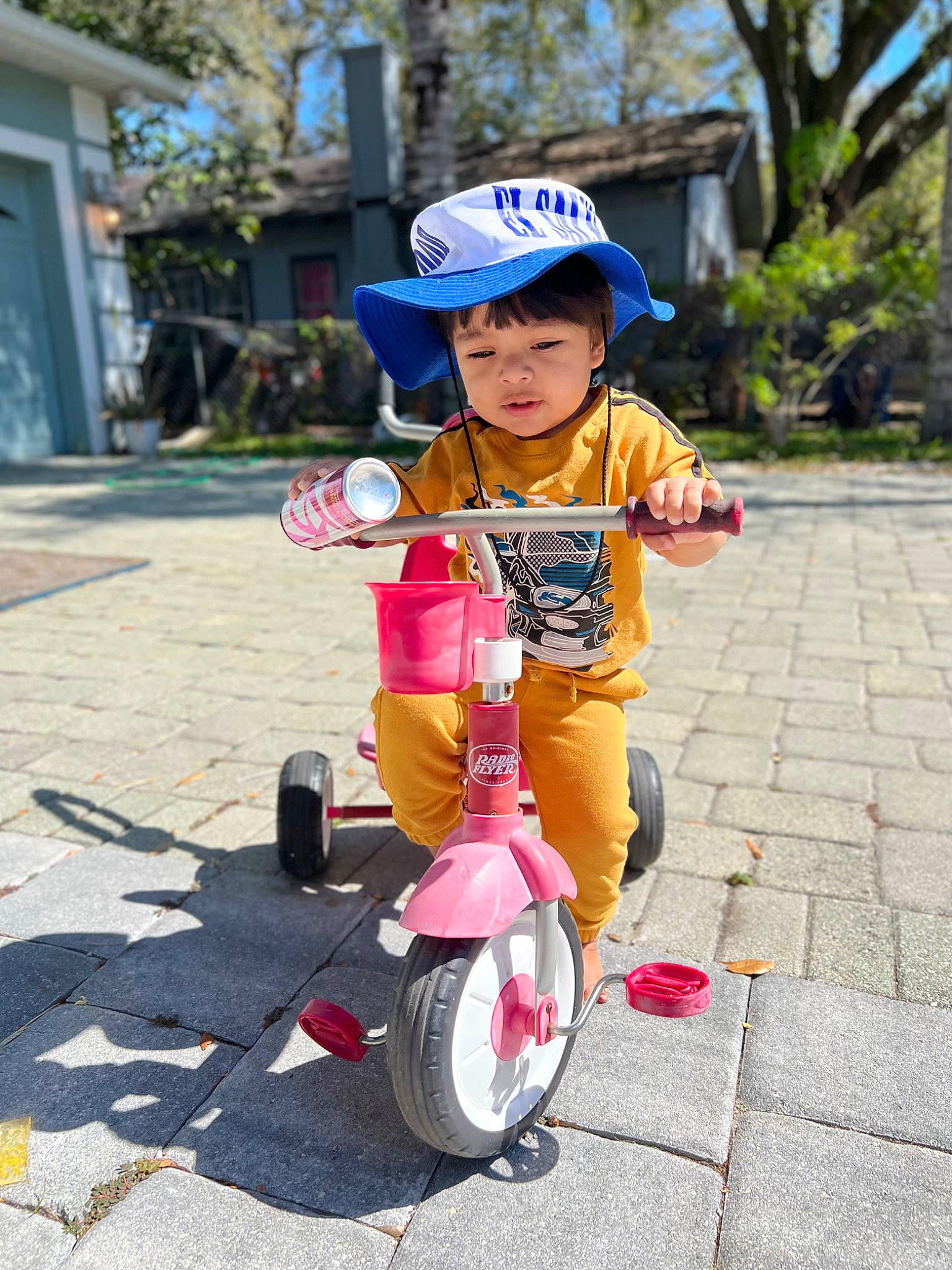 Josiah is registered to the contest to win money with this photo: bicycle, bicycle_accessory, bicycle_helmet, bicycle_part, bicycle_tire, bicycle_wheel, bicycles_equipment_and_supplies, cycling, face, headgear, helmet, person, personal_protective_equipment, plant, recreation, riding_toy, tire, toddler, tree, vehicle