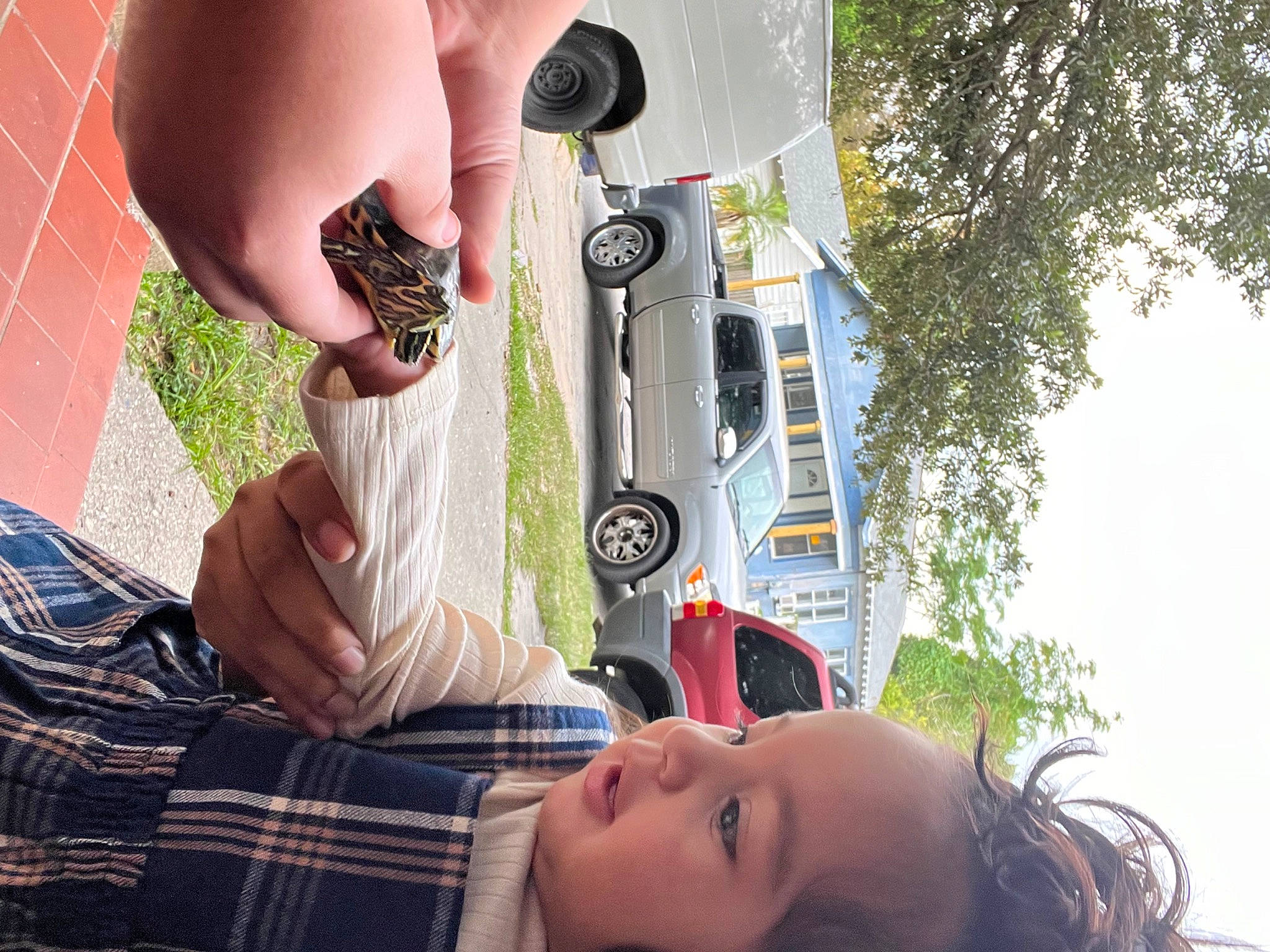 Nevaeh joined the competition — help win amazing prizes! automotive_exterior, automotive_lighting, automotive_tire, bumper, car, grass, green, hand, light, motor_vehicle, person, plant, summer, sunlight, tartan, tire, tree, vehicle, vehicle_door, wheel