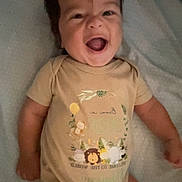 Ma'Kari joined the competition — help win amazing prizes! arm, baby, child, clothing, cute, expression, face, happy, head, indoors, infant, joy, leg, lying_down, onesie, person, playful, skin, smiling, toddler