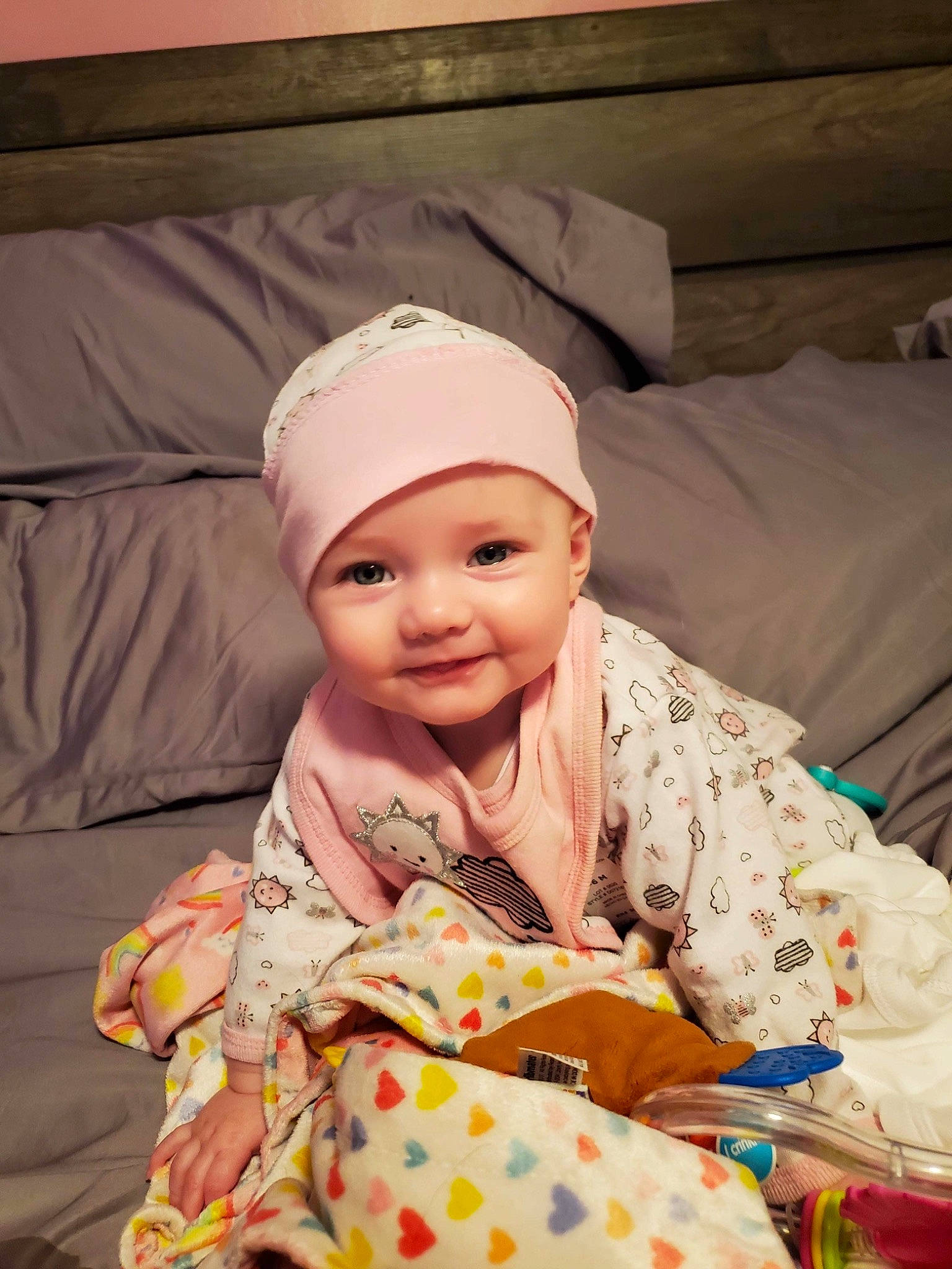 Melody joined the competition — help win amazing prizes! baby, baby_toddler_clothing, cap, child, comfort, event, eye, fun, happy, head, headgear, headwear, human_body, joy, linens, pattern, person, room, sitting, sleeve