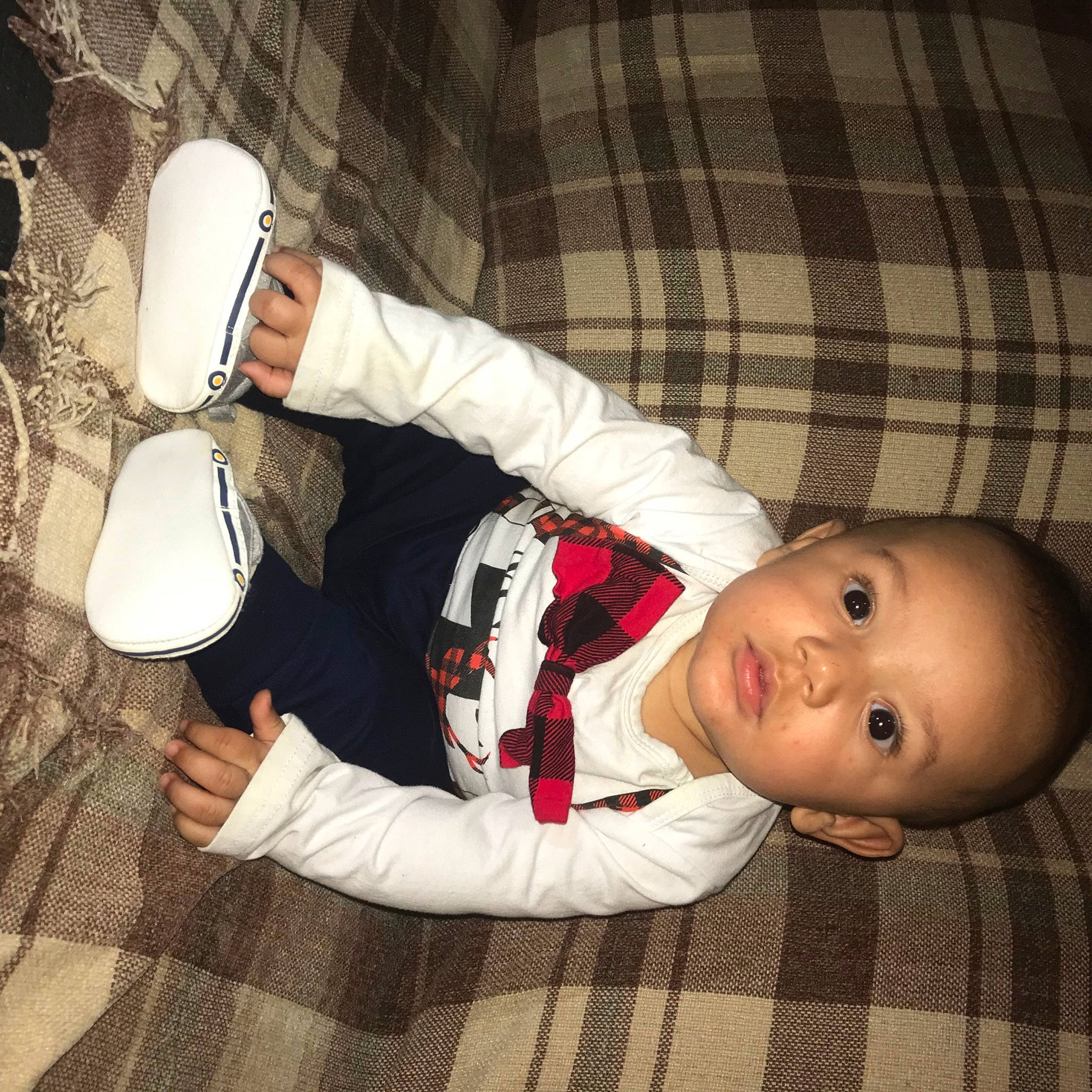 Jayden joined the competition — help win amazing prizes! baby, baby_toddler_clothing, carmine, cheek, child, collar, comfort, elbow, flash_photography, flooring, fun, glove, mouth, pattern, person, sitting, sleeve, tartan, toddler, wood