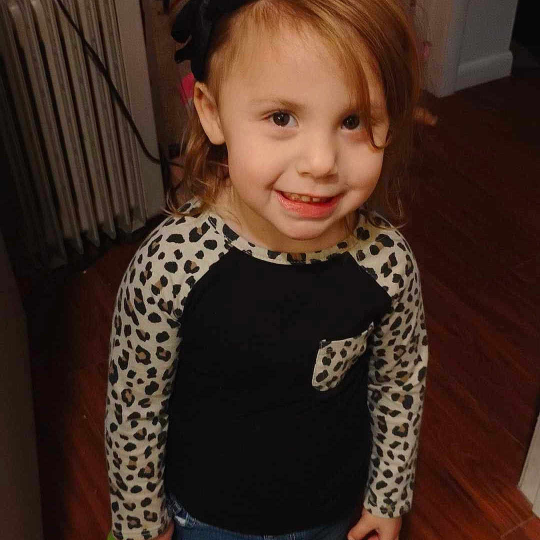 Tayler joined the competition — help win amazing prizes! child, clothing, coat, face, female, footwear, girl, hardwood, head, indoors, interiordesign, jeans, pants, person, photography, portrait, shoe, sneaker, t_shirt, wood