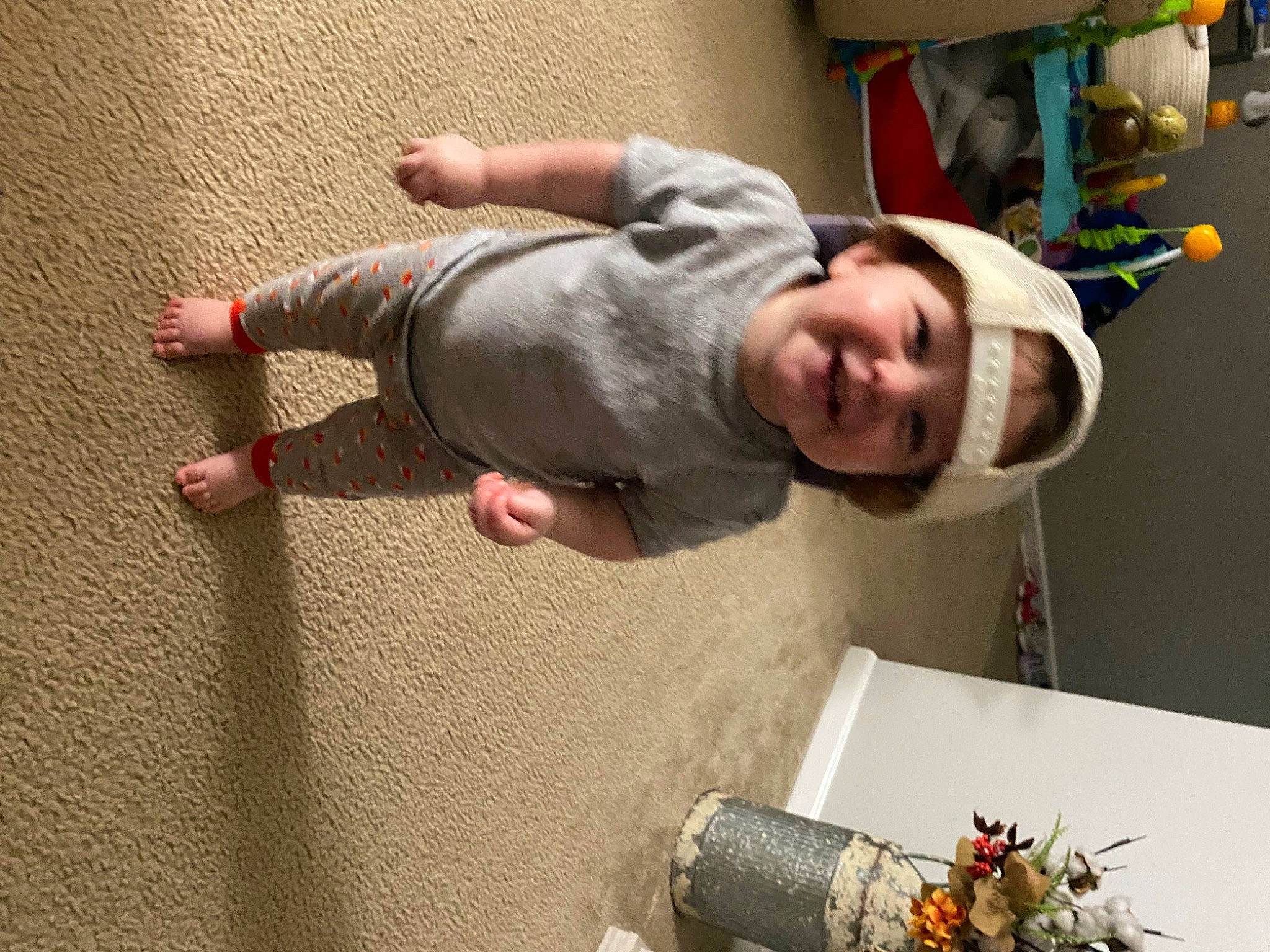 Hailey is registered to the contest to win money with this photo: baby, child, elbow, event, flooring, foot, fun, happy, headwear, jewellery, joy, person, photography, play, room, smile, t_shirt, toddler, wood