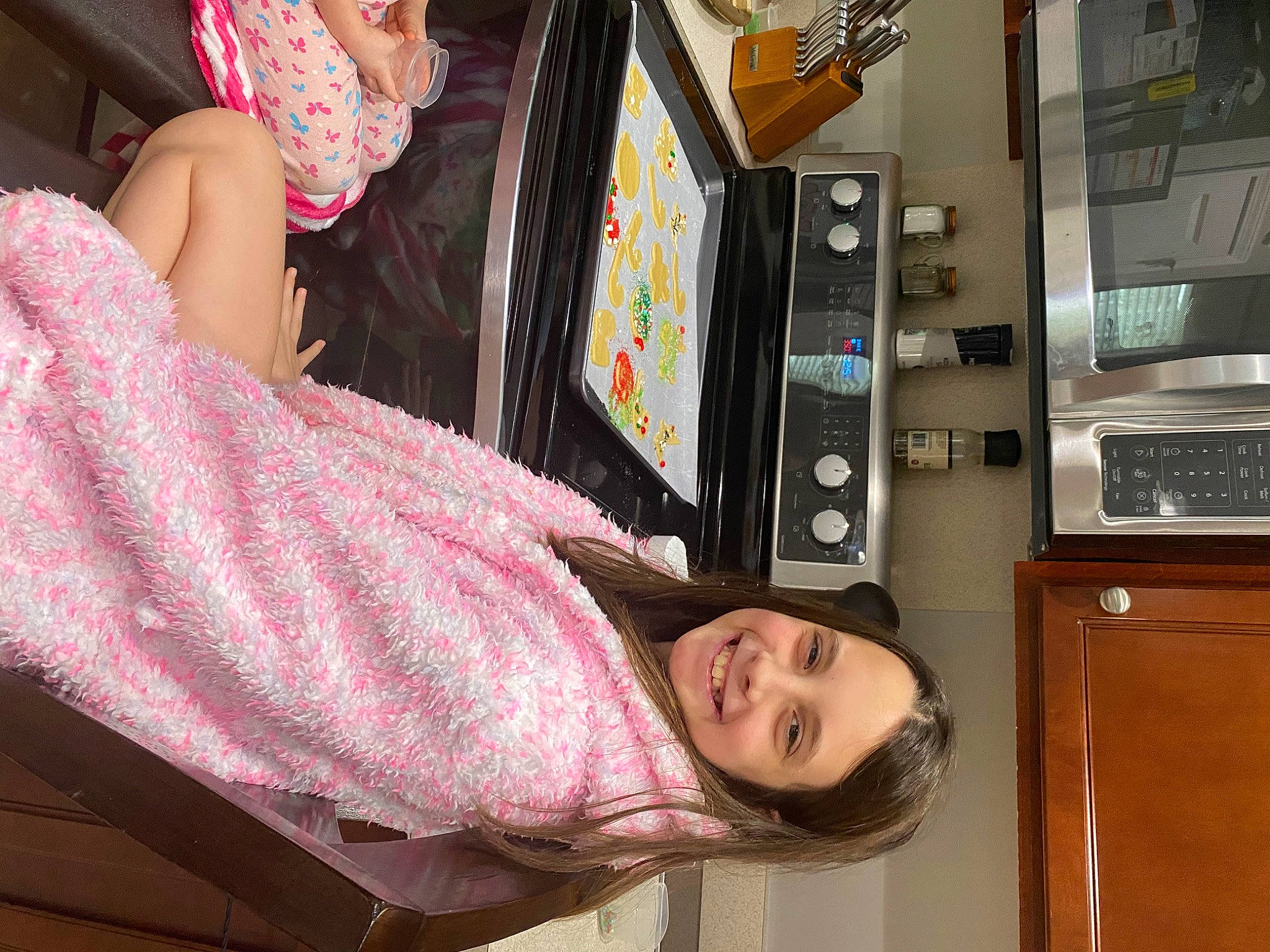 Madison is registered to the contest to win money with this photo: audio_equipment, child, eyewear, fun, hat, joy, leisure, machine, magenta, pattern, person, room, smile, sun_hat, t_shirt, transport