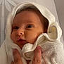 Kyara participe au concours pour gagner de l'argent avec cette photo : baby, infant, towel, hand, face, wrapped, white, skin, expression, curious, newborn, soft, cozy, child, person, portrait, indoors, caring, gentle, warm