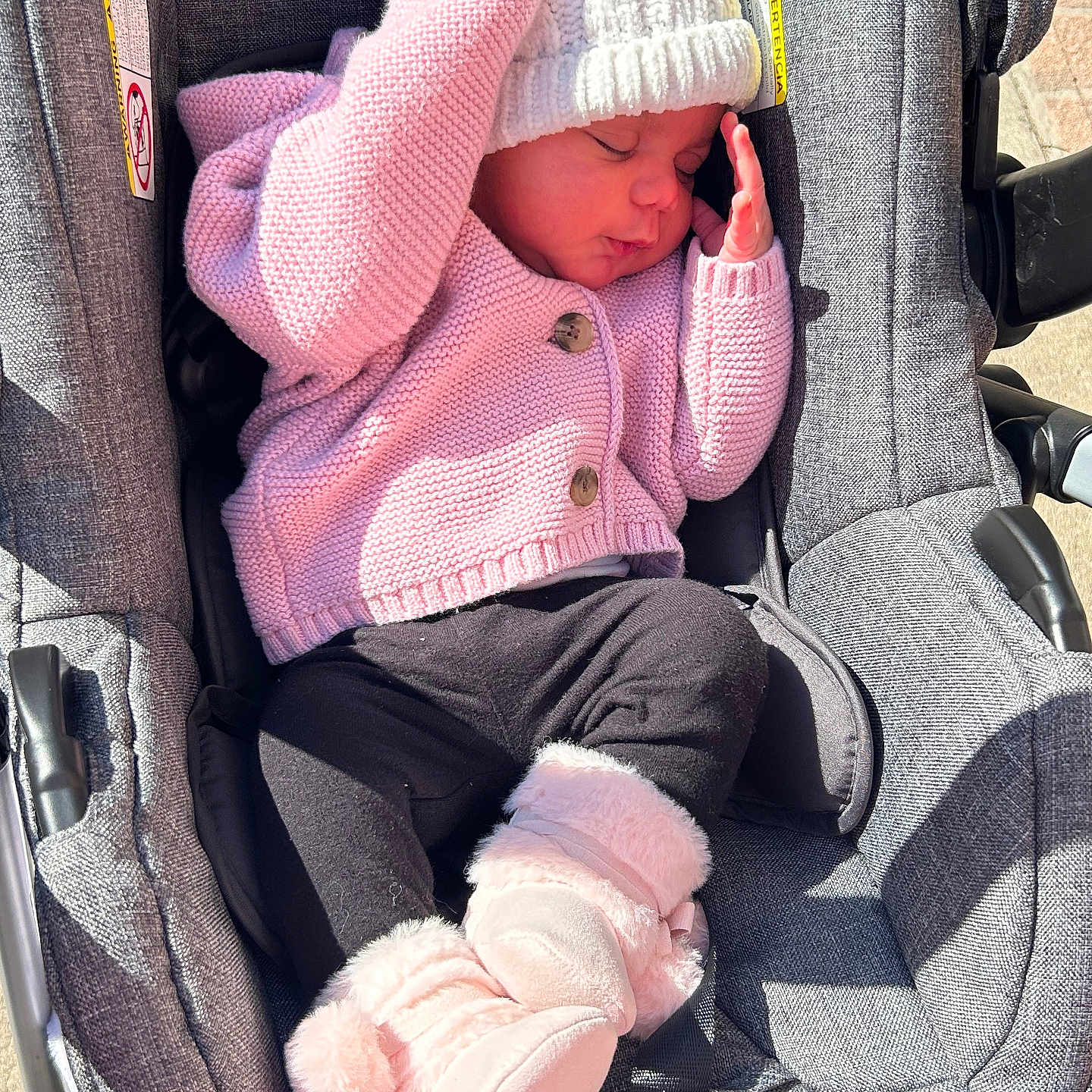 Mikiyzah is registered to the contest to win money with this photo: baby, bonnet, cap, car, car_interior, carseat, clothing, face, hat, head, hosiery, knitwear, newborn, person, photography, portrait, sock, sweater, transportation, vehicle