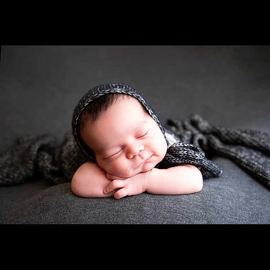 Jaelyn joined the competition — help win amazing prizes! baby, child, closeup, comfort, cozy, cute, grey_blanket, hands, head, indoors, infant, knitted_bonnet, newborn, peaceful, portrait, relaxation, resting, sleeping, soft_texture, warm