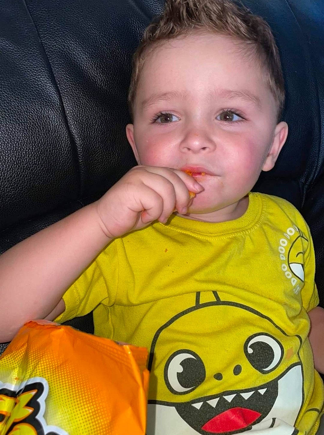 Kian is registered to the contest to win money with this photo: baby_toddler_clothing, cheek, ear, eyelash, face, facial_expression, finger, forehead, gesture, happy, head, iris, lip, mouth, nose, orange, organ, person, skin, sleeve