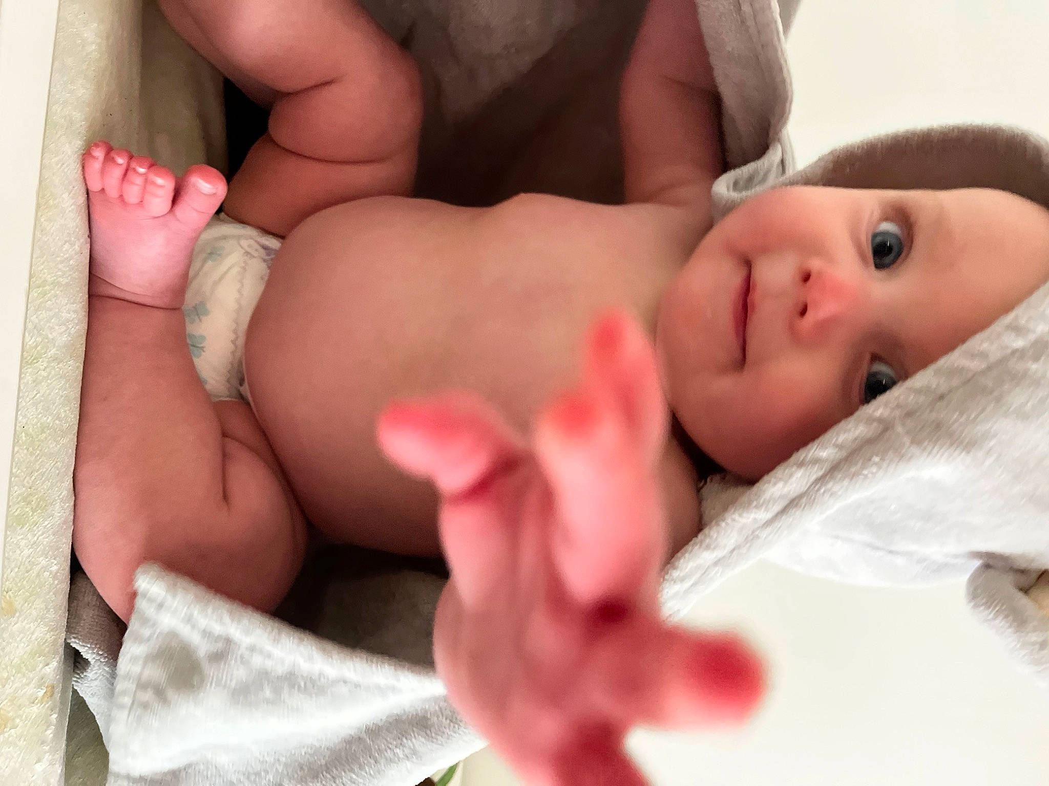 Erika is registered to the contest to win money with this photo: abdomen, arm, baby, cheek, chest, comfort, eyelash, finger, foot, gesture, headwear, human_body, human_leg, knee, nail, person, skin, stomach, thigh, thumb