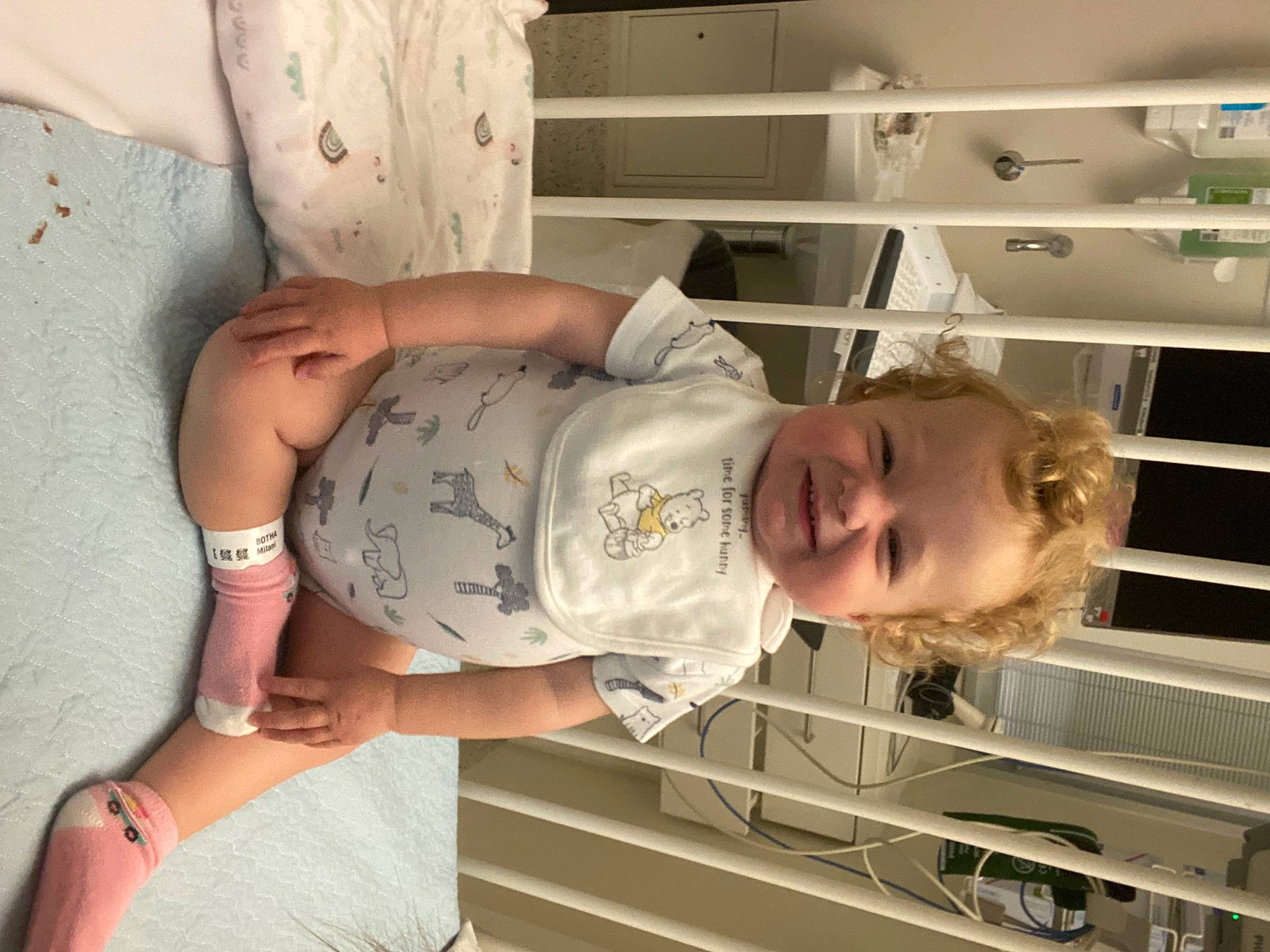 Milani is registered to the contest to win money with this photo: abdomen, baby, baby_toddler_clothing, child, comfort, elbow, foot, hat, human_leg, joy, knee, leg, pattern, person, product, room, shelf, sleeve, t_shirt, thigh