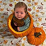baby, pumpkin, autumn, fall, leaf_pattern, blanket, orange, child, cute, overalls, smiling, sitting, head, face, seasonal, holiday, indoors, portrait, costume, festive