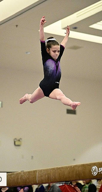 Lucy joined the competition — help win amazing prizes! artistic_gymnastics, athlete, balance, barefoot, choreography, competition_event, entertainment, event, flooring, gymnastics, human_leg, knee, leotard, performing_arts, person, recreation, sports, sports_uniform, sportswear, swimwear