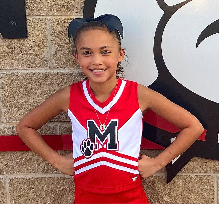 Amiya joined the competition — help win amazing prizes! cheerleading_uniform, child, clothing, jersey, joy, person, sleeveless_shirt, smile, sports_uniform, sportswear, style, t_shirt, team, uniform