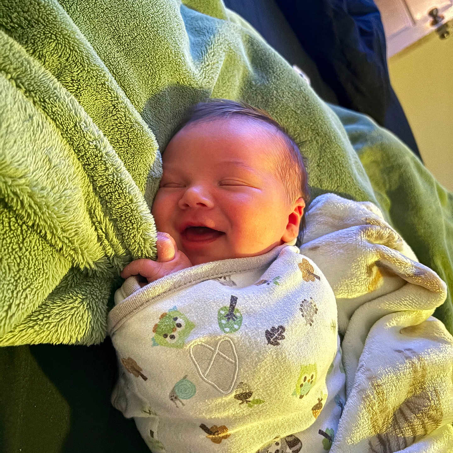Aiden James is registered to the contest to win money with this photo: animal_print, baby, bedroom, blanket, comfort, cozy, cute, happy, indoors, infant, newborn, pattern, rest, sleeping, smile, soft, swaddle, towel, warm, wrapped