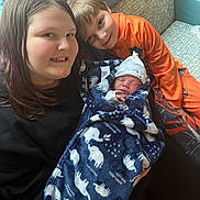 Aiden James is registered to the contest to win money with this photo: child, baby, siblings, blanket, couch, smile, happy, indoor, family, portrait, newborn, boy, girl, clothing, face, cute, cozy, warm, resting, love