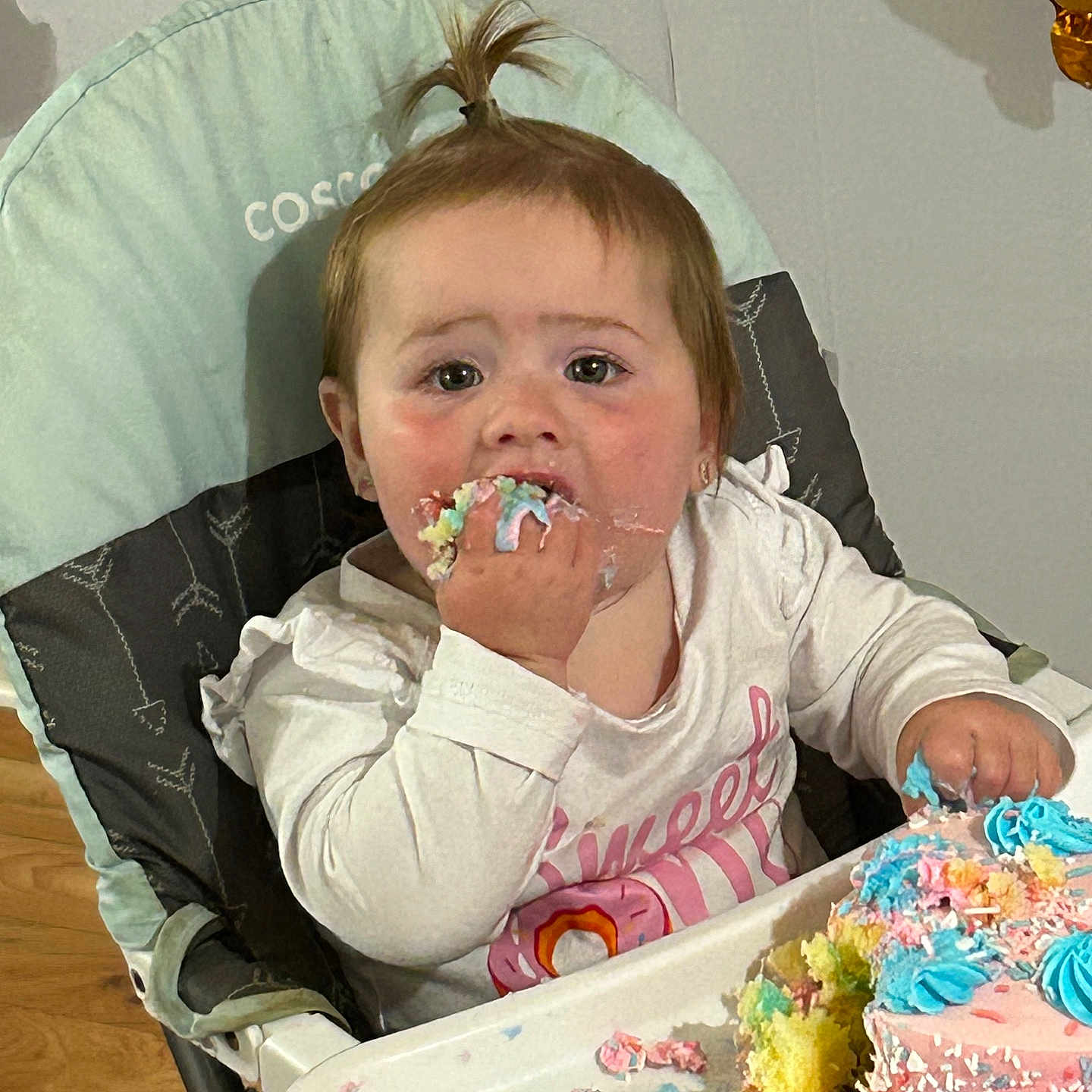 Kenzie is registered to the contest to win money with this photo: baby, birthdaycake, bread, cake, chair, cream, cutlery, dessert, eating, face, food, furniture, head, icing, people, person, photography, portrait, spoon, sweets