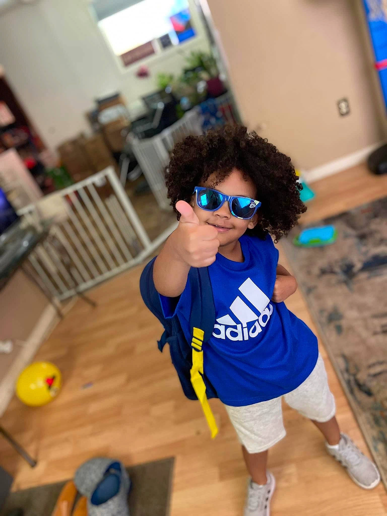 Justus joined the competition — help win amazing prizes! electric_blue, eyewear, fashion_design, flooring, fun, happy, hardwood, human_leg, jersey, joy, leisure, person, personal_protective_equipment, recreation, room, sleeve, sportswear, sunglasses, t_shirt, thigh