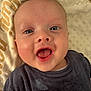 baby, blanket, blue_eyes, child, closeup, clothing, cute, expression, face, happy, head, indoors, infant, lying_down, mouth_open, portrait, skin, smiling, soft_texture, young_child
