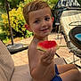 Colson is registered to the contest to win money with this photo: child, boy, watermelon, smile, outdoor, summer, patio, chair, umbrella, greenery, garden, food, fruit, happy, hair, skin, cushion, table, sunlight, casual